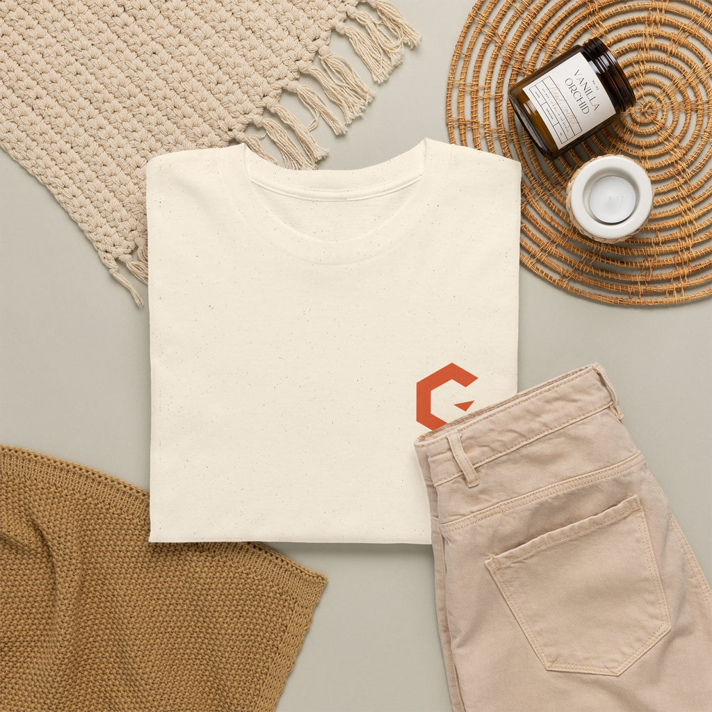 Walking Signal Tee product render: natural tee, back print of a figure mid-stride inside a burnt orange ring, orange C mark on the left chest