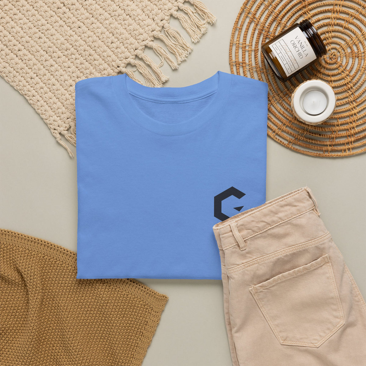 C Slash Tee in Carolina Blue, flat lay with jeans