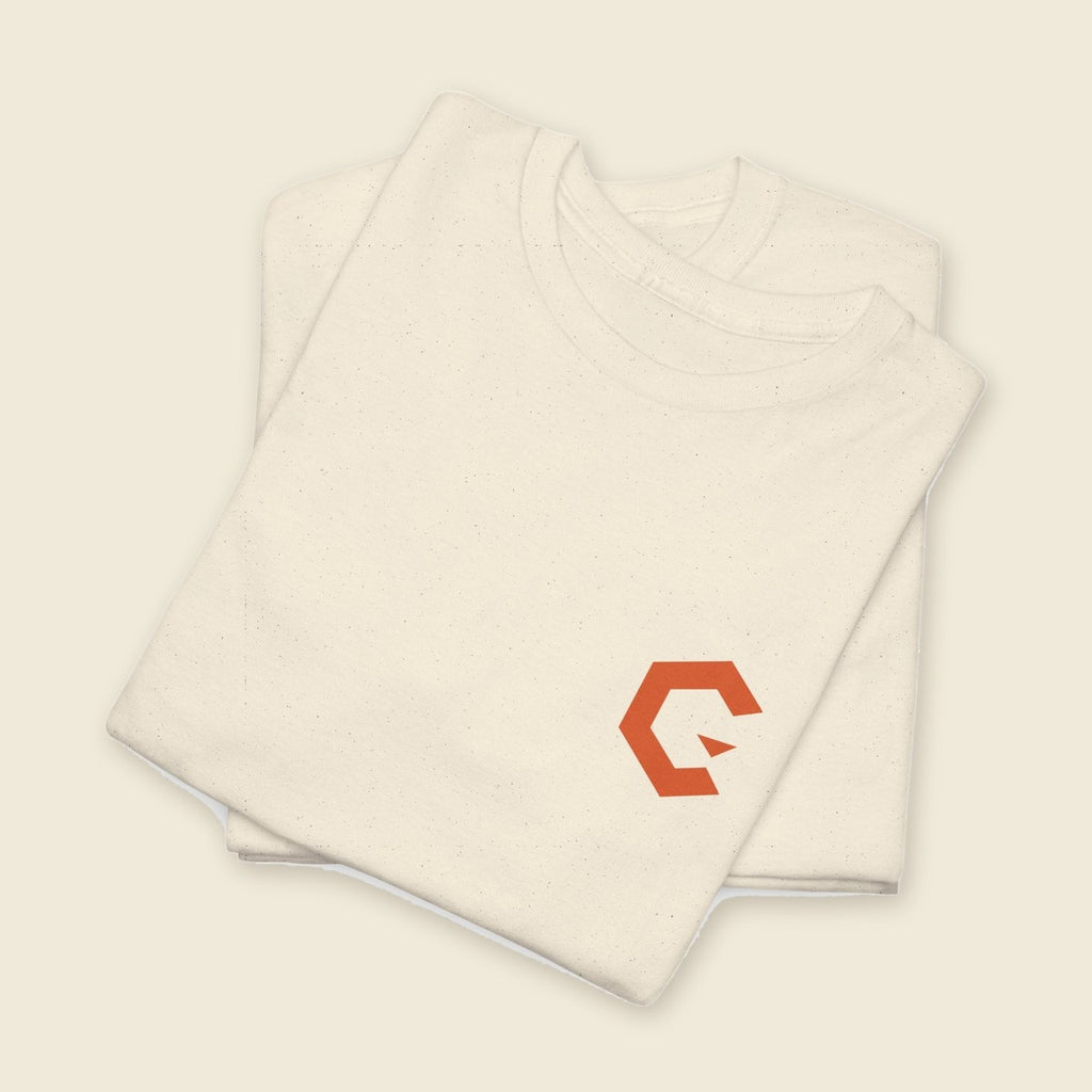 Street Signal Tee product render: natural tee, back print of a burnt orange street poster with a creature and the CUWORA wordmark, orange C mark on the left chest