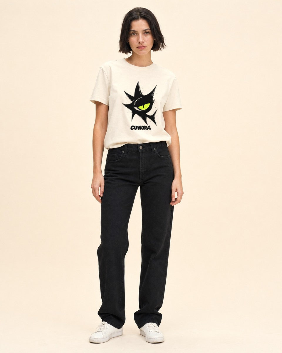 Model wearing the Signal Eye Tee in Natural, front view with the black eye print and CUWORA wordmark