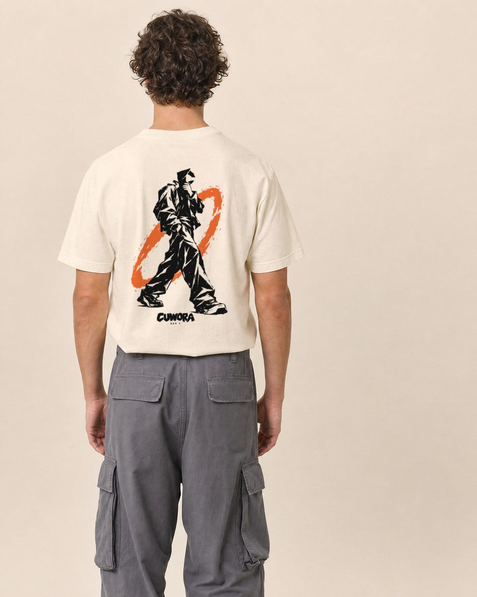 Model wearing the Walking Signal Tee in Natural, back view with the walking figure and burnt orange ring print