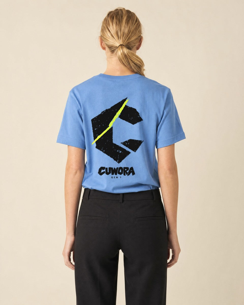 Model wearing the C Slash Tee in Carolina Blue, back view with the black C and acid lime slash print