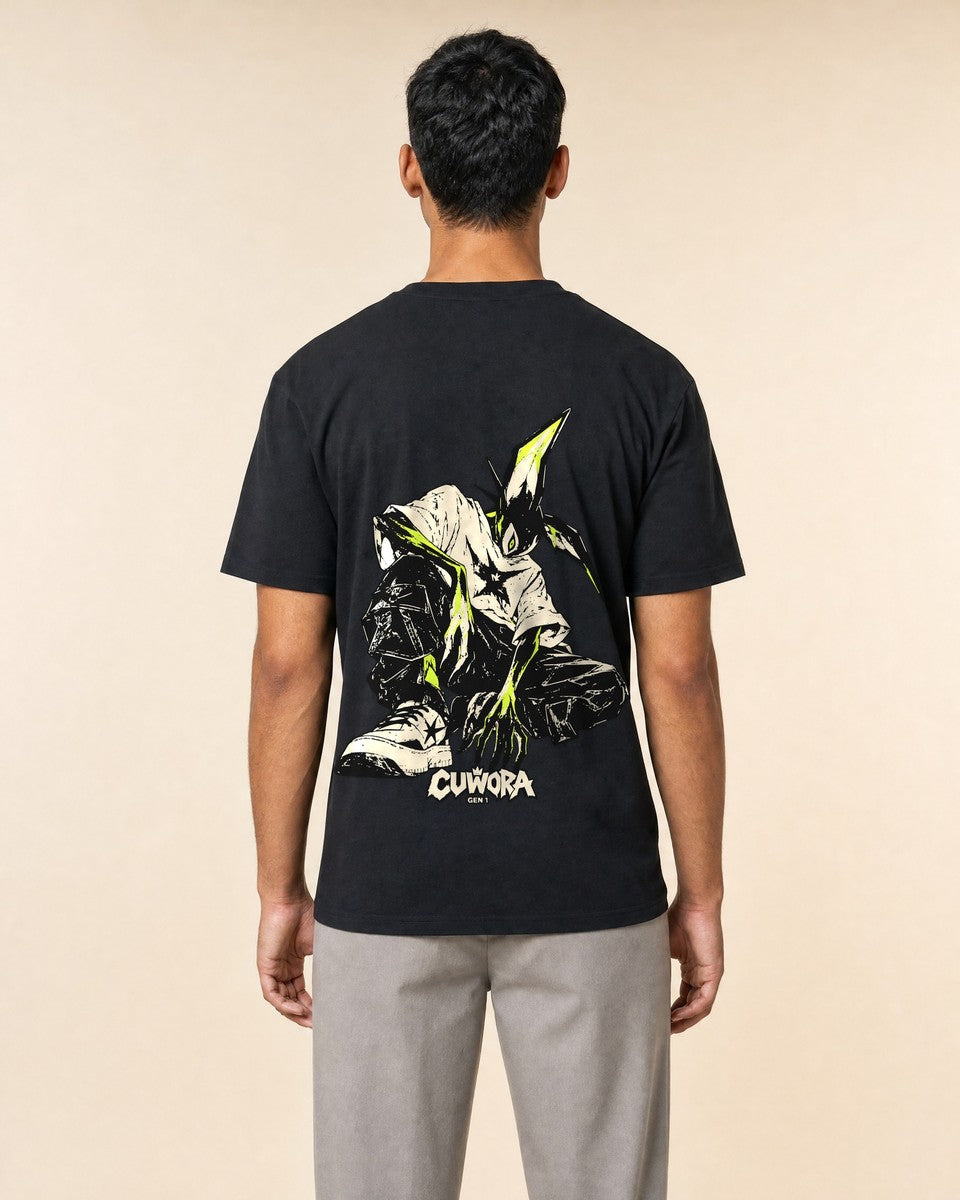 Model wearing the Signal Creature Tee in Black, back view with the crouched creature print in bone and acid lime